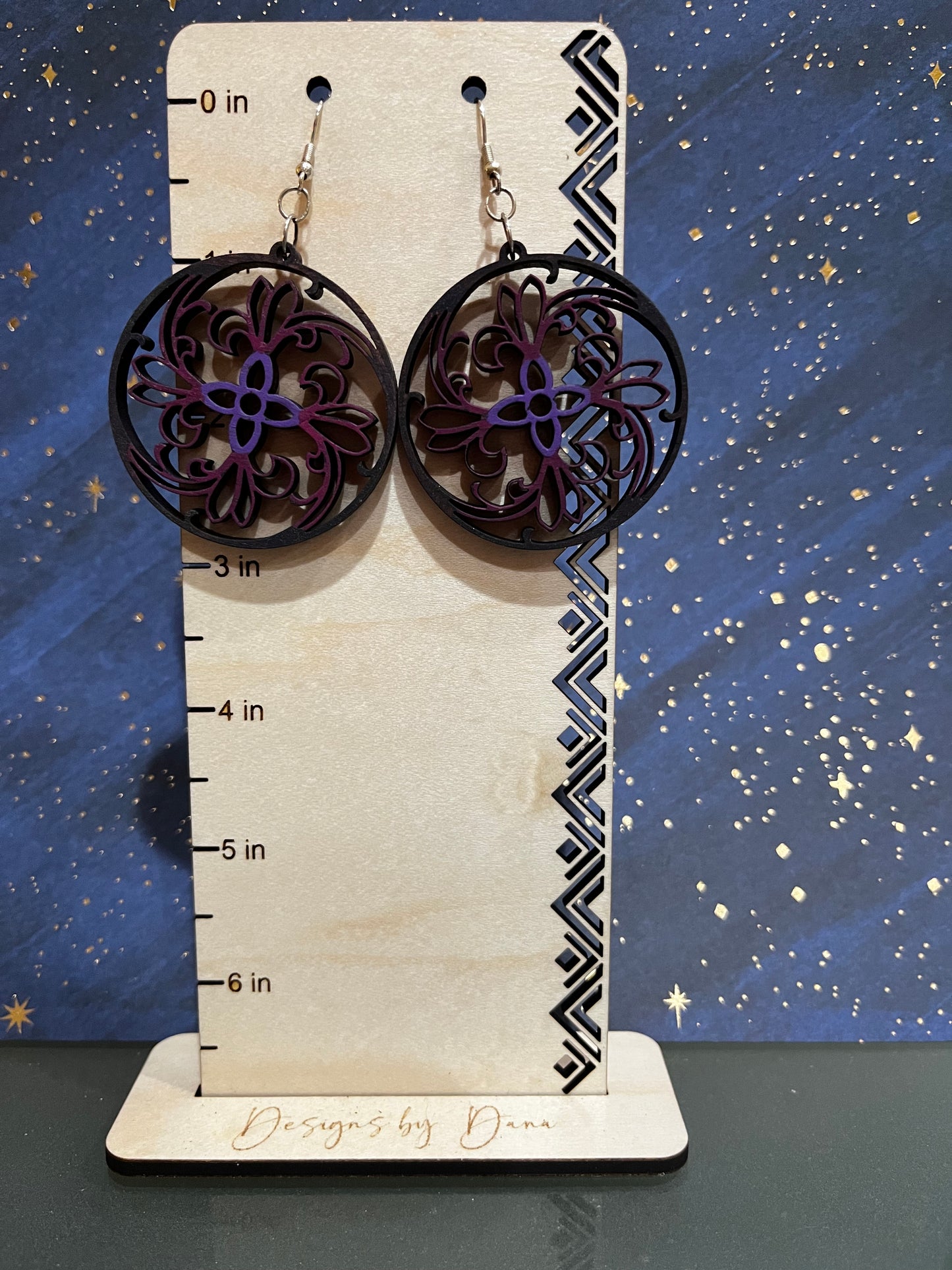 Wooden filigree earrings with purple center