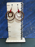 Large layered hoops with red faux leather tab
