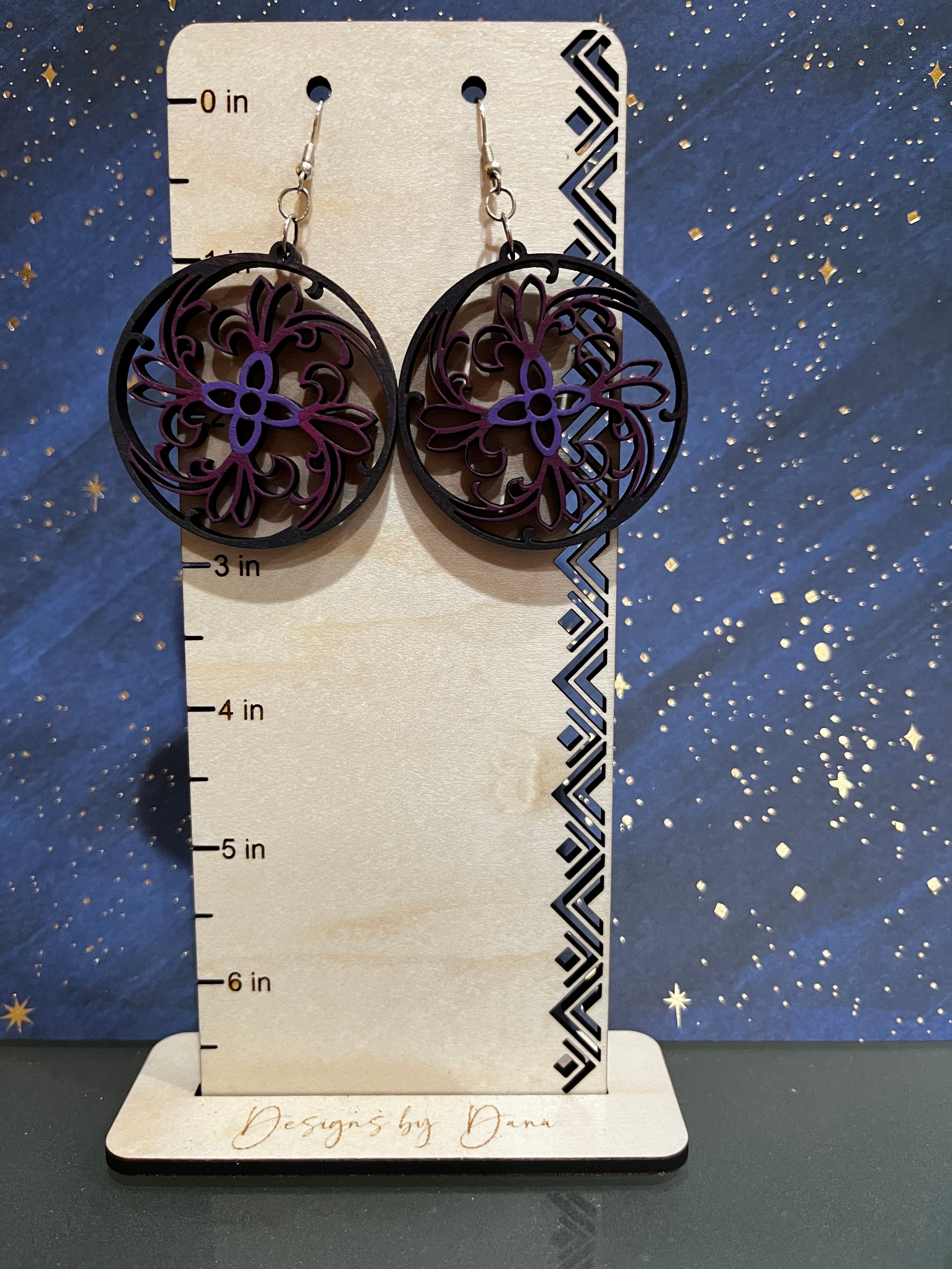 Wooden filigree earrings with purple center