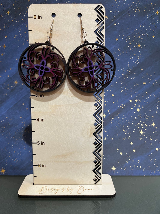 Wooden filigree earrings with purple center