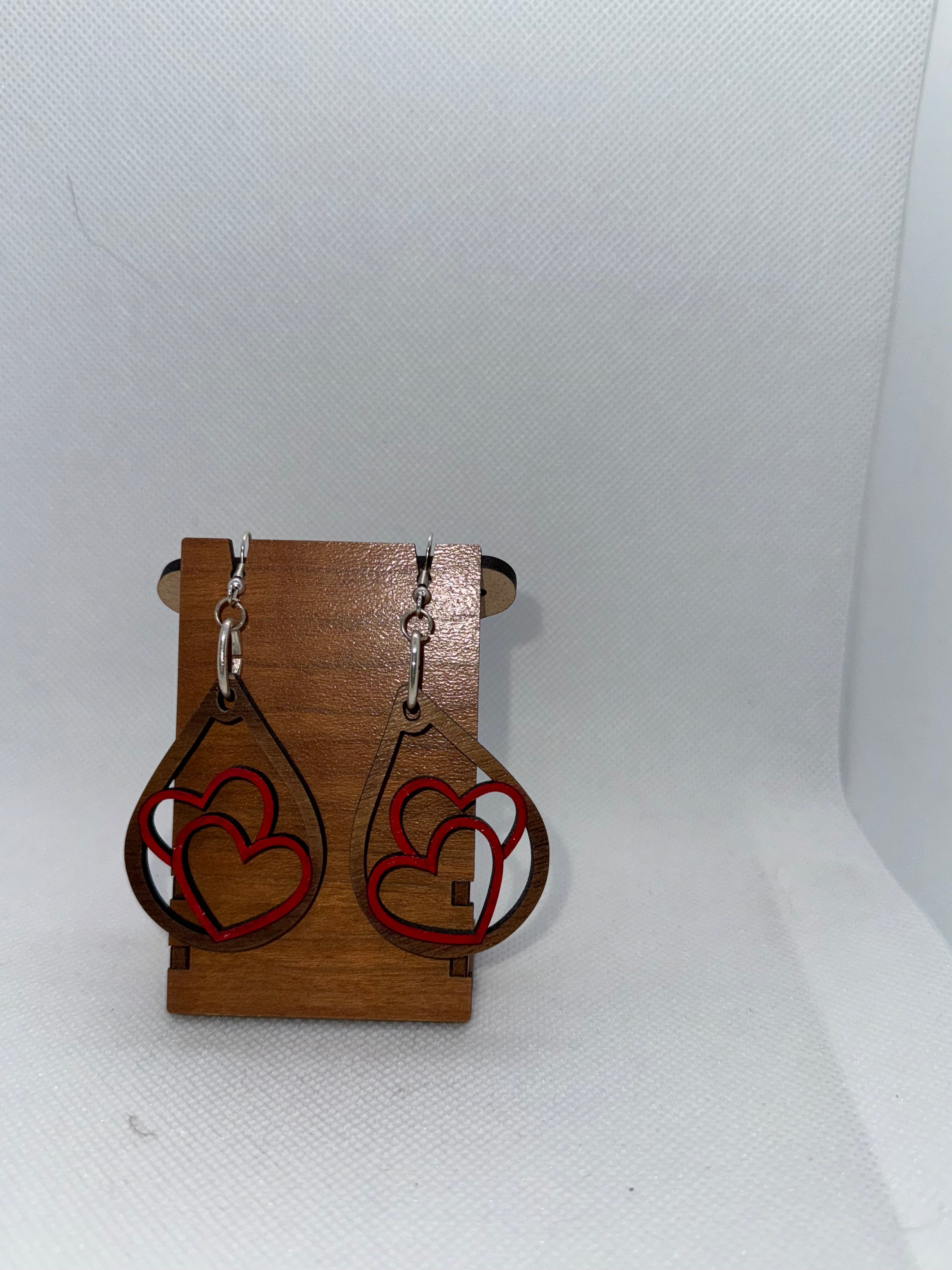 Wooden dangle earring with two hearts